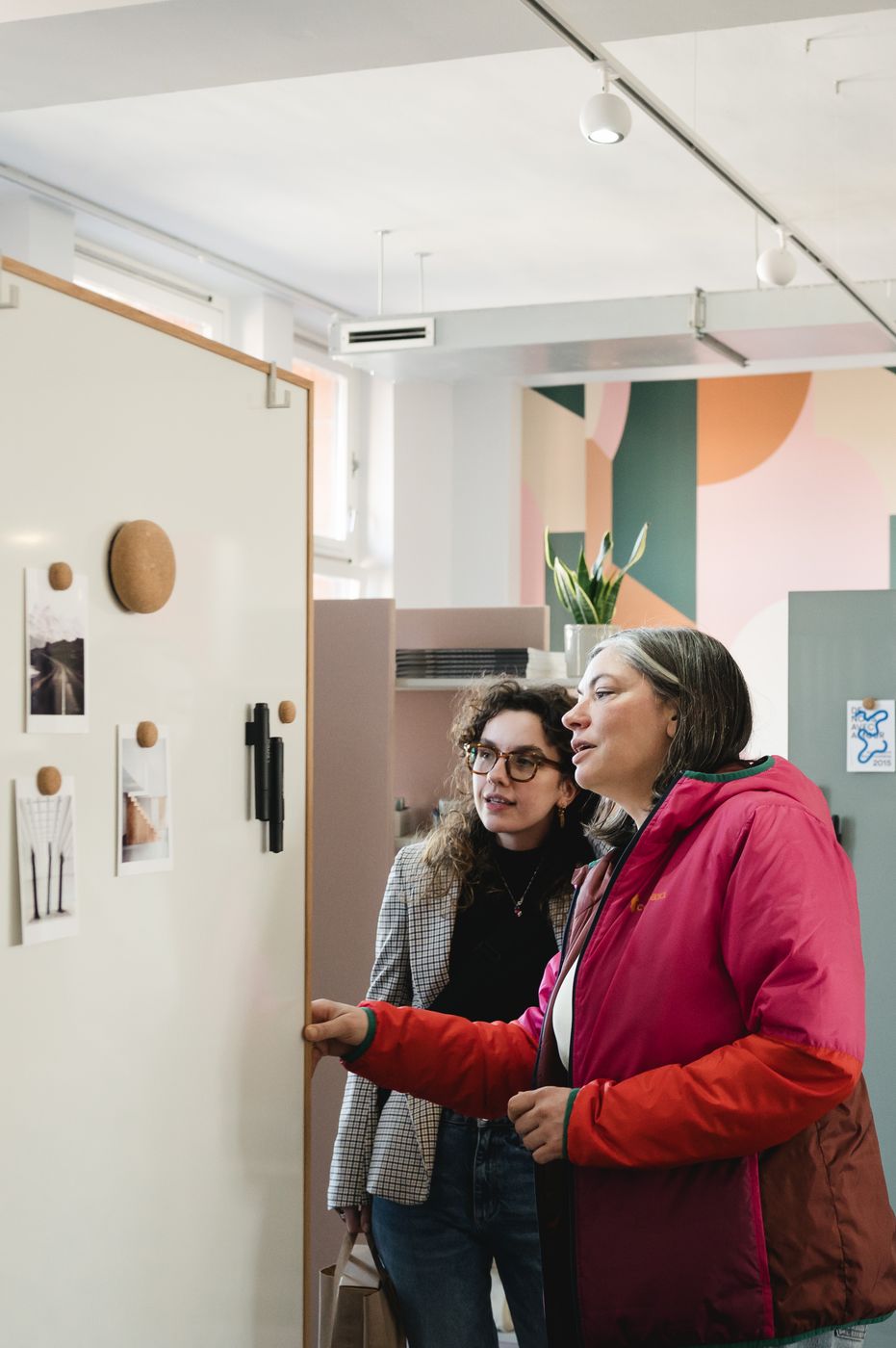 Two designers looking at a member display at Il Salotto